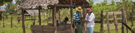 Kayin state. An ICRC staff member assesses the conditions of a well to prevent water shortages, which are common during the dry season.