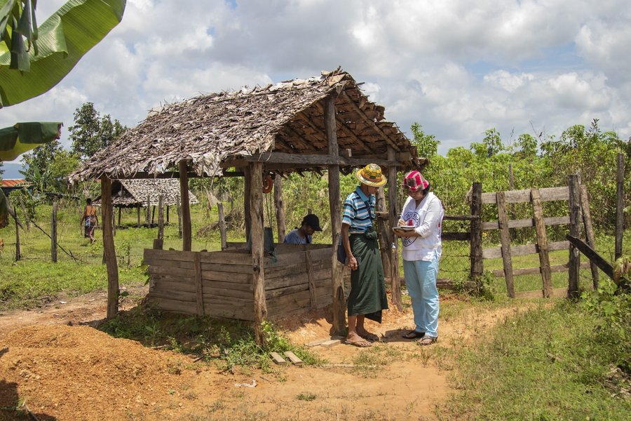 Kayin state. An ICRC staff member assesses the conditions of a well to prevent water shortages, which are common during the dry season.