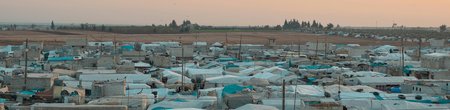 Overhead view of a refugee camp at sunset
